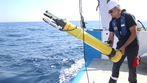 A colleague of the project participating Laboratoire d'Océanographie in Villefranche-sur-mer (LOV), France, while deploying the RAMSES equipped float [Image: LOV].