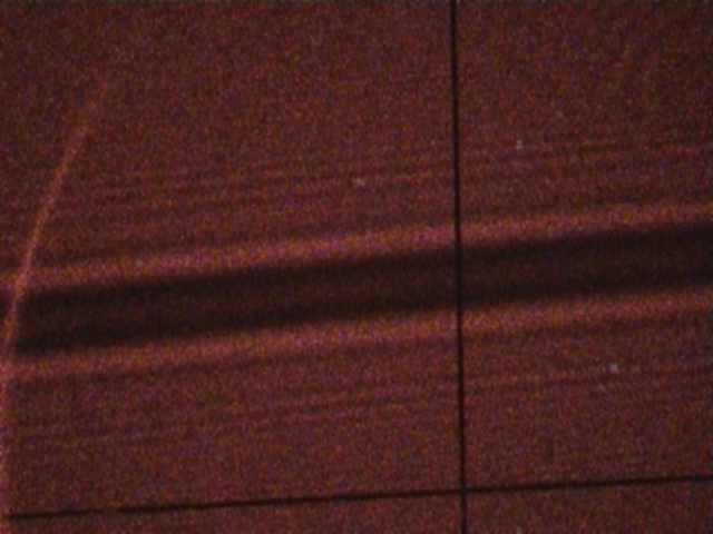 Foto der Beugung von Laserlicht an einem Draht.