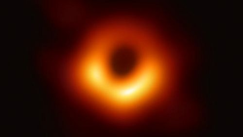The first image of a black hole is relatively blurred. It shows a dark spot surrounded by a luminous ring.