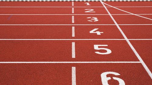 Close-up of a running track with the numbers of the different starting positions.