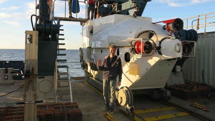 The submersible is located at the rear of the research vessel, the device that launches it into the water can be seen. 