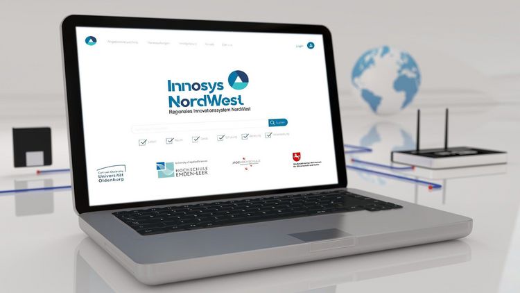 Opened laptop, the project logo can be seen on the screen.