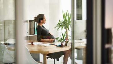 woman, business, female, young, people, women, alone, adult, baby, pregnant, one, mother, looking, sitting, working, 20s, work, holding, attractive, brunette, inside, person, real, casual, dress, businesswoman, health, desk, corporate, caucasian, worker, professional, businessperson, modern, copy space, indoors, job, executive, authentic, pregnancy, maternity, adults, businesspeople, full length, joy, stomach, content, touching, workplace, paperwork