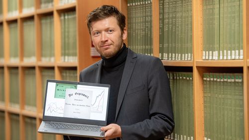 Haim Stiemer with a digitised archive on his computer.