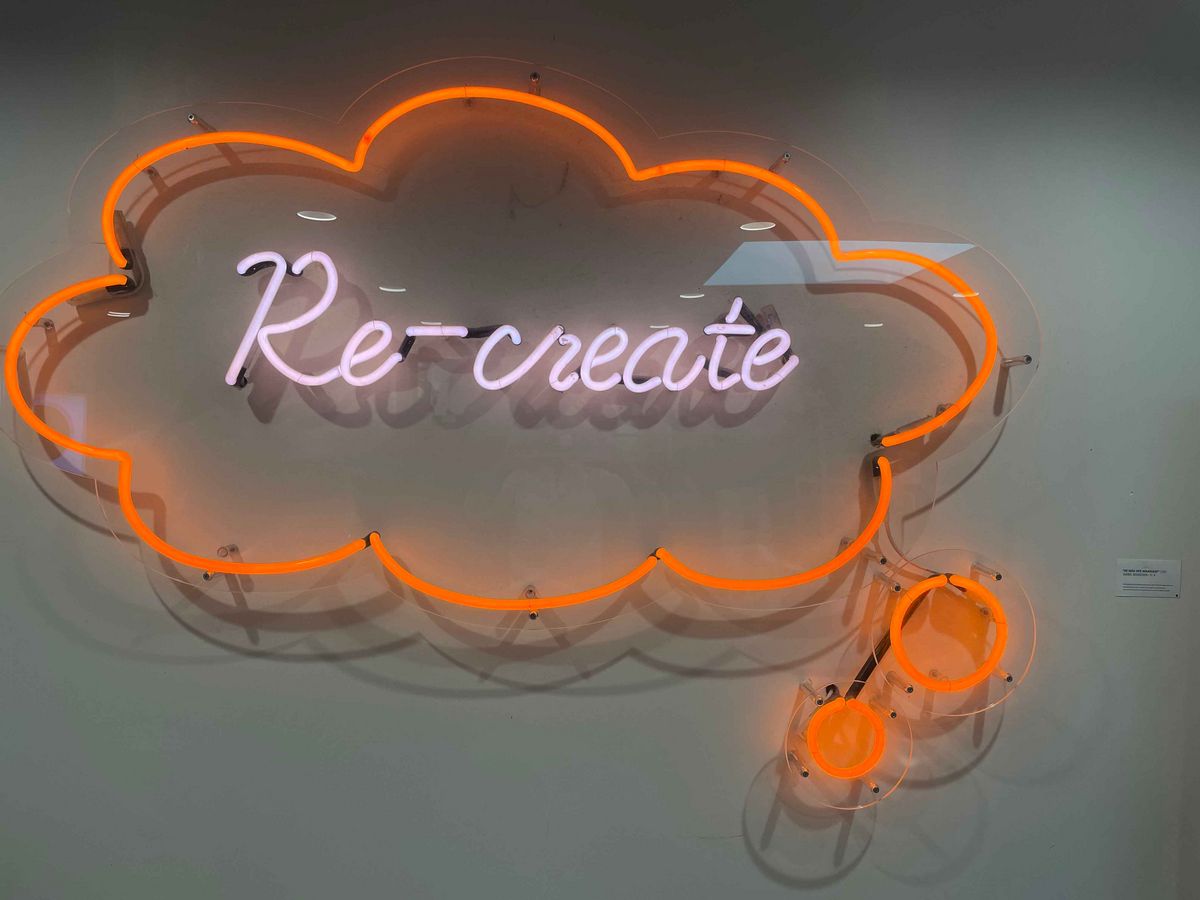  A neon installation with the word "Re-create".
