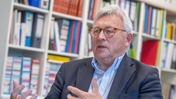 Picture of Brinker in conversation.