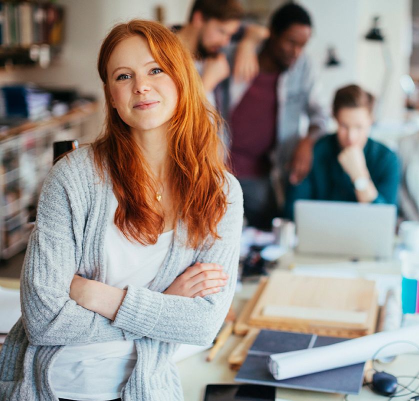 Portrait of a young woman in a modern office