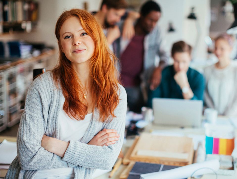 Portrait of a young woman in a modern office