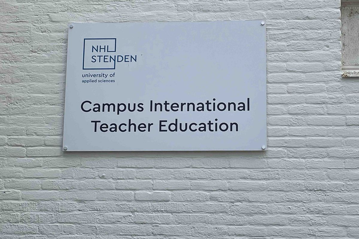 A sign with the logo of "NHL Stenden university of applied sciences" and the text "Campus International Teacher Education".