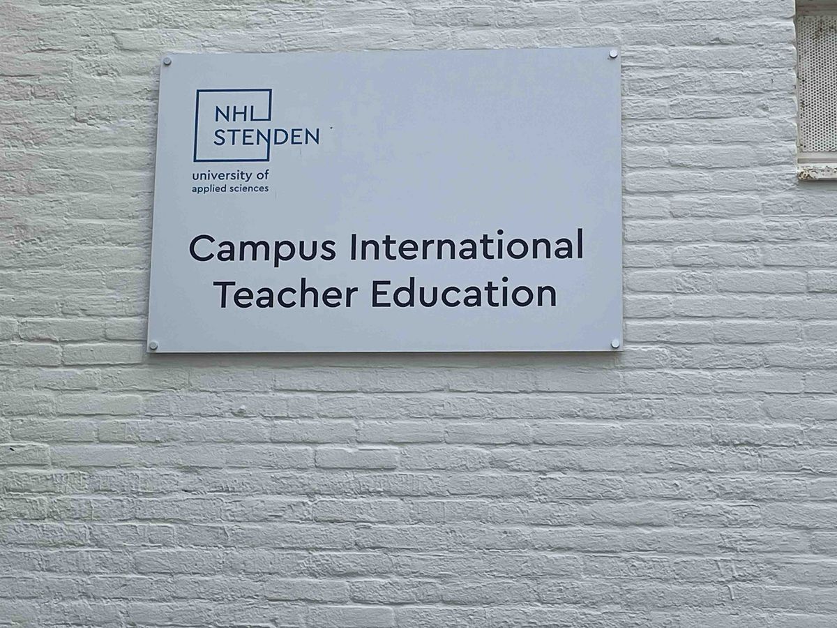 A sign with the logo of "NHL Stenden university of applied sciences" and the text "Campus International Teacher Education".