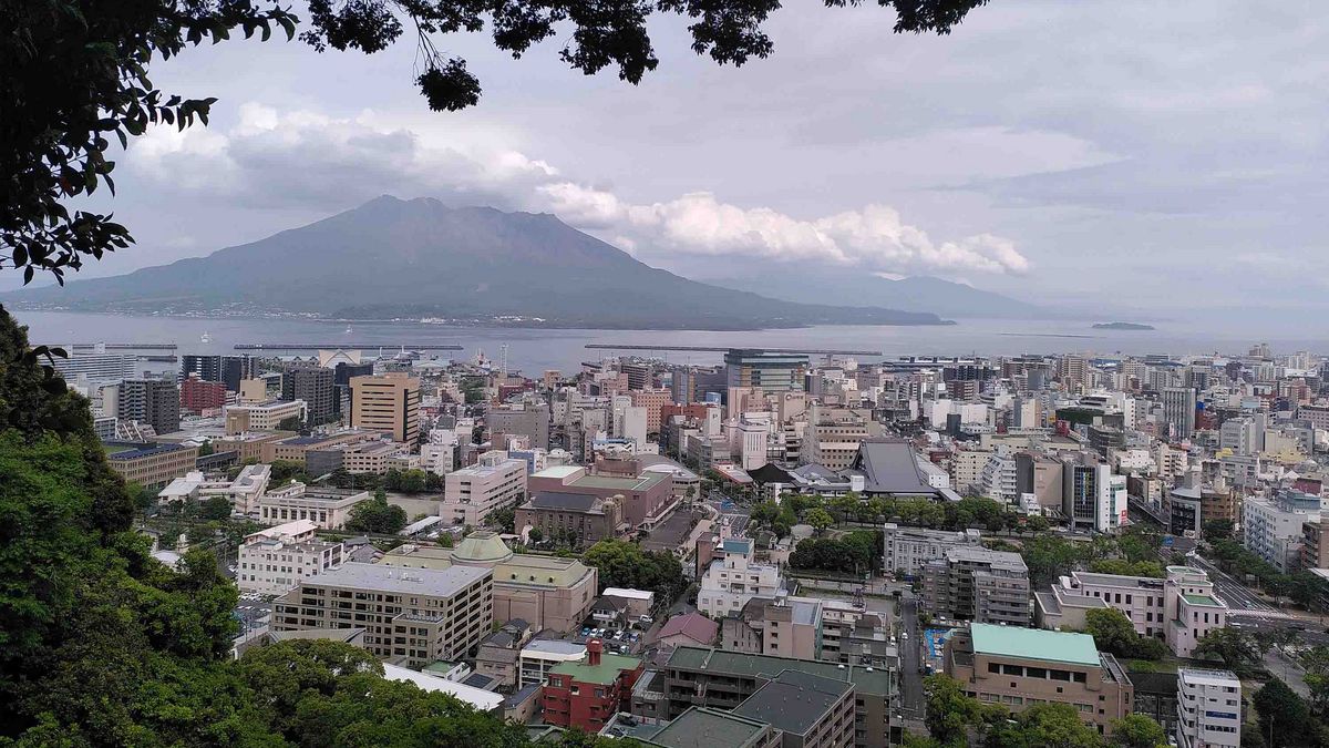 A view over Kagoshima city with the Sakurajima volcano in the background.