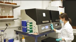 Woman in laboratory using incubator