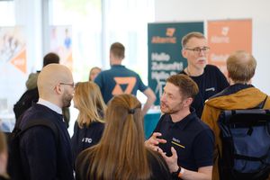 Exhibitors in conversation with visitors