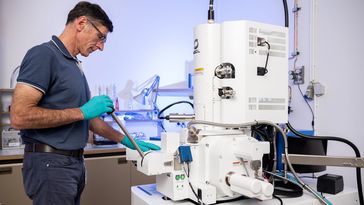 Michael Winklhofer stands at the field emission scanning electron microscope