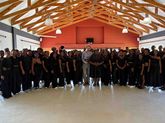 Krystoffer Dreps with the choir of the George Campus of Nelson Mandela University 